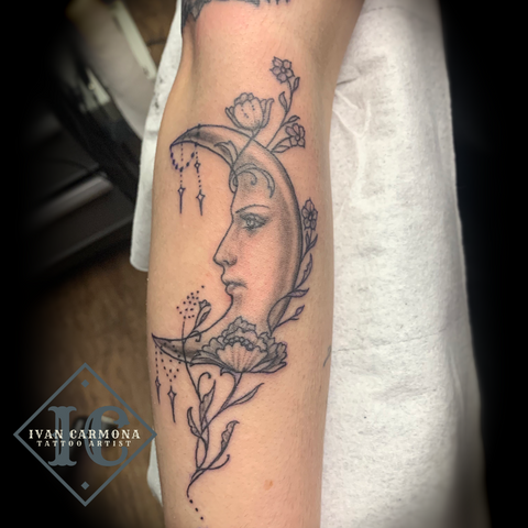 Astronomy Tattoo With A  Bejeweled Moon And Flowers In Black Gray On The Forearm Tatuaje De Astronomía Con Una Luna Adornada, Flores, Y Tinta Negra Y Gris En El Antebrazo<br>