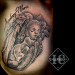 Commemorative Tattoo Of A Baby With  Angel Hands And  Wings On The Chest In Black And Gray Tatuaje Conmemorativo De Un Bebé Con Manos Y Alas De Ángel En El Pecho Con Tinta Negra Y Gris<br>