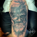 Norse Tattoo On The Arm With A Face Of A Viking, A Moon Sky, And A Wolf In The Trees In Black And  Gray Tatuaje Nórdico En El Brazo Con La Cara De Un Vikingo, Un Cielo Lunar Y Un Lobo En Los Árboles En Negro Y Gris<br>